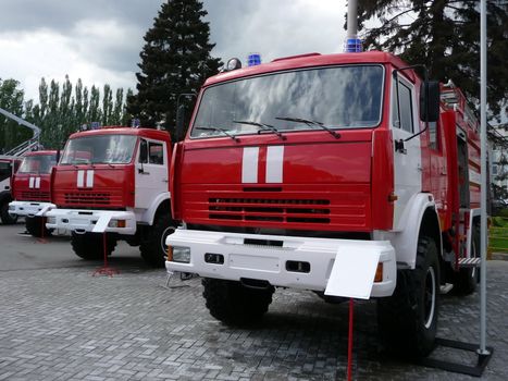 Line of red fire trucks at the exhibition