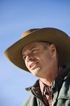 Middle-aged Caucasian male wearing a cowboy hat.