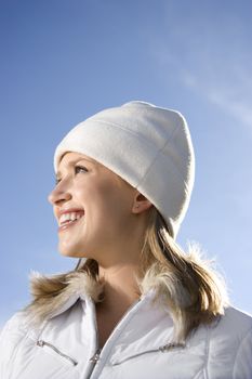 Portrait of a mid-adult Caucasian female with blue sky in background.