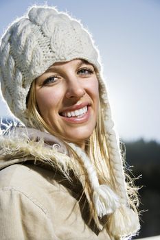 Young adult Caucasian woman outdoors in winter attire.