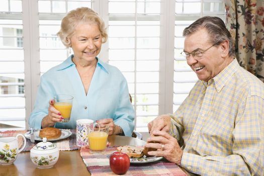 Mature Caucasian couple having breakfast together.