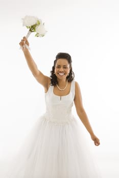 Portrait of a mid-adult African-American bride on white background.