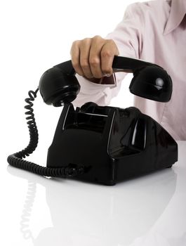 Female hands hanging a vintage phone