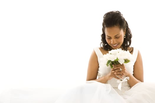 Mid-adult African-American bride on white background.