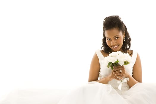 Mid-adult African-American bride on white background.