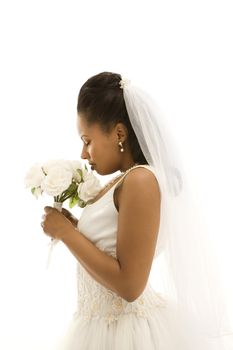 Mid-adult African-American bride on white background.