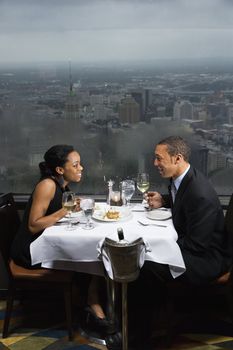 African-American couple having dinner at the Tower of the Americas in San Antonio, Texas.