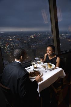 African-American couple having dinner at the Tower of the Americas in San Antonio, Texas.