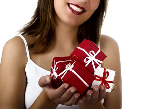 Christmas season! Different poses of a beautiful woman with small gifts on the hands.  (Focus is especially on the gifts)