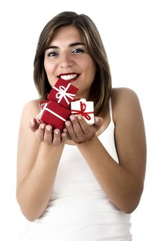 Christmas season! Different poses of a beautiful woman with small gifts on the hands.  (Focus is especially on the gifts)
