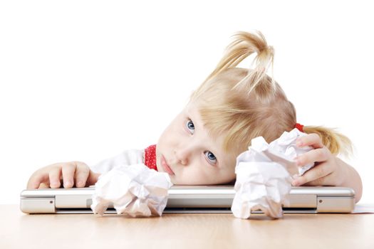 pensive child at the table