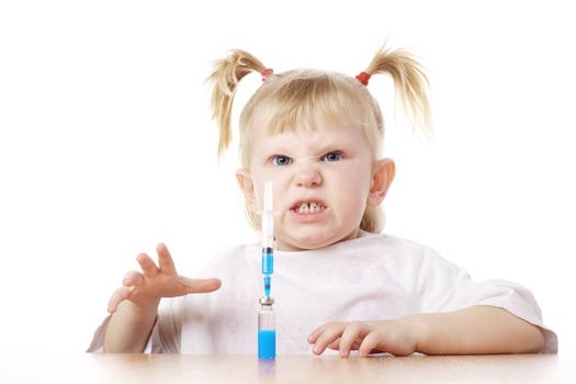 child playing as a doctor with syringe