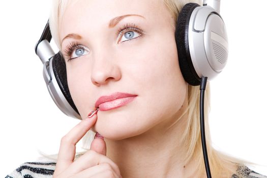 a pensive girl in headphones listening music