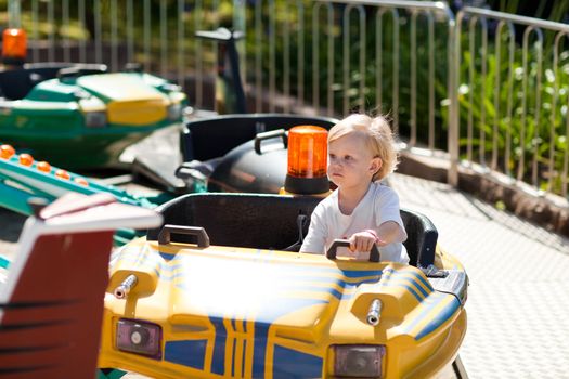 child in park of attractions
