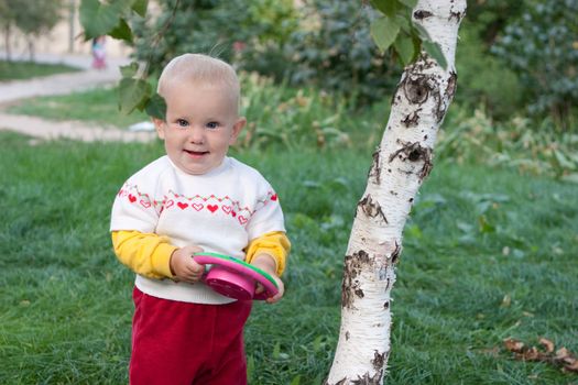 playing child near the tree