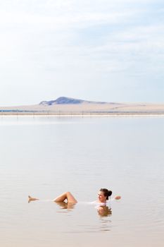happy girl swim in salt lake