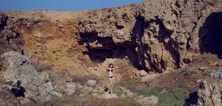 panorama with a girl in the mountain