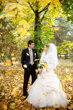 bride and groom in the park