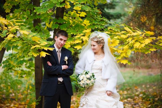 bride and groom in the park