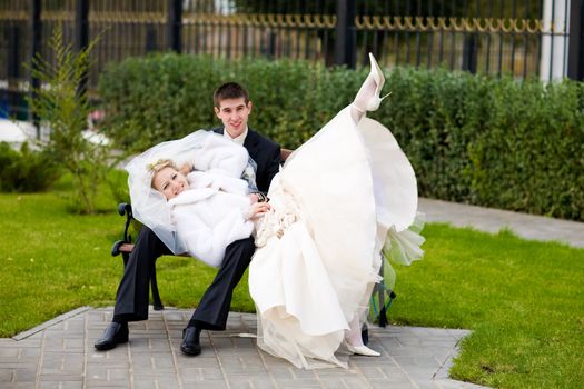 bride and groom in the park