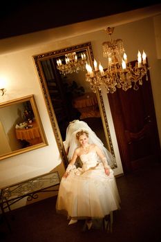 bride near the mirror at darkness