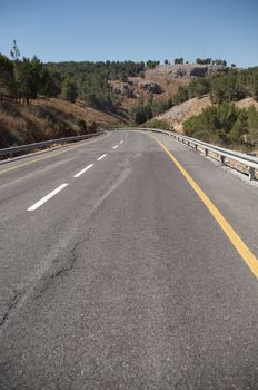 A view of an empty highway road .