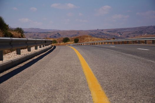 A view of an empty highway road .