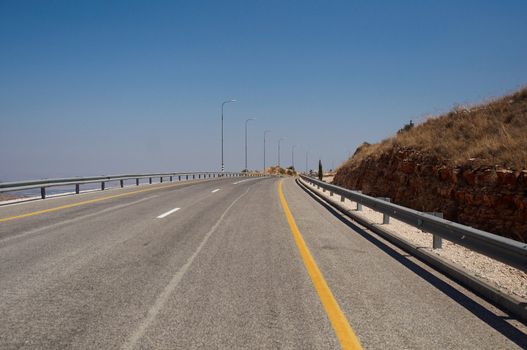 A view of an empty highway road .