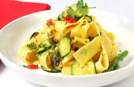 Pappardelle (wide ribbon pasta) with courgette and asparagus and a creamy sauce.