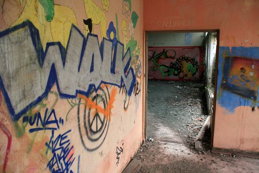 old house with graffiti in the walls