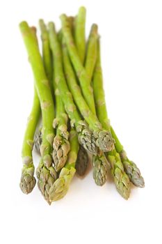 Bunch of asparagus, isolated on white with soft shadow.