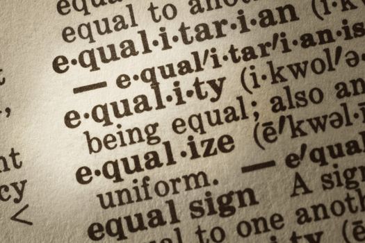 Dictionary definition of "equality".  Close-up view, showing paper textures.