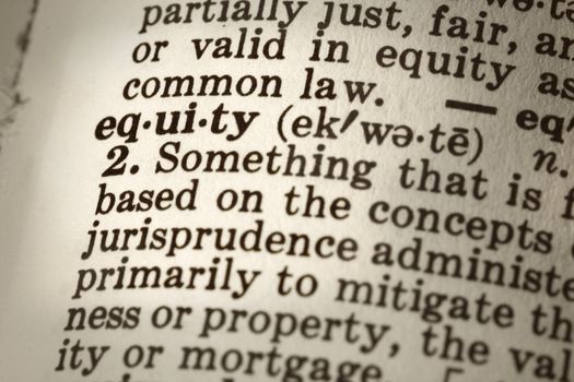 Dictionary definition of the word "equity".  Close-up view, with sepia tone and differential focus.