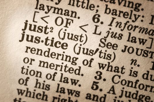 Dictionary definition of "justice".  Close-up view, with good paper textures.