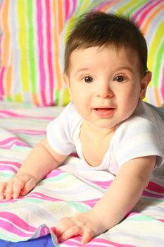 smiling baby on varicolored background