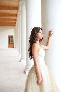 romantic portrait of the bride near pillars