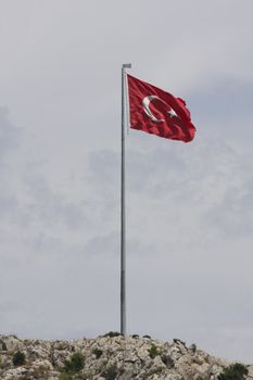 Turkish Flag blowing in the wind on a flag pole