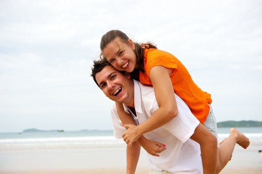 Younf couple enjoying the beach in Brazil