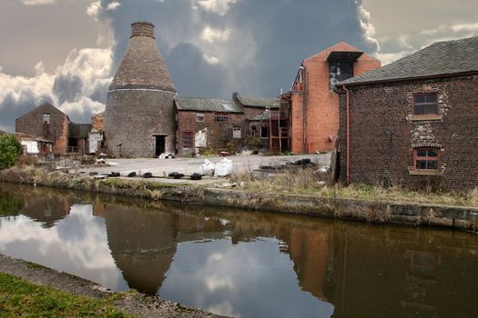 An abandoned pottery factory stands allongside the Trent and Mersey canal that in bygone times transported it's products.
