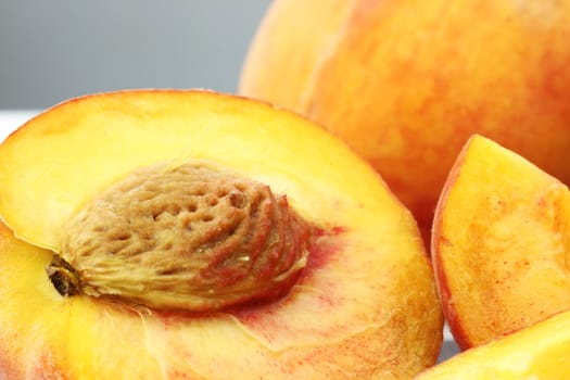 Close up of sliced ripe peaches. Shallow DOF.