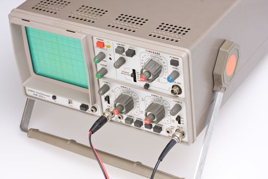 analogue oscilloscope on grey background