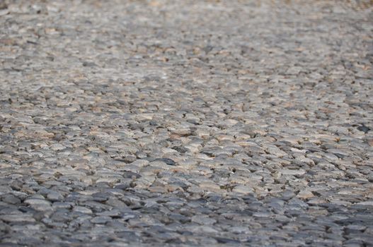 Closeup of a very old walkway made of found stones