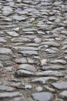 Closeup of a very old walkway made of found stones
