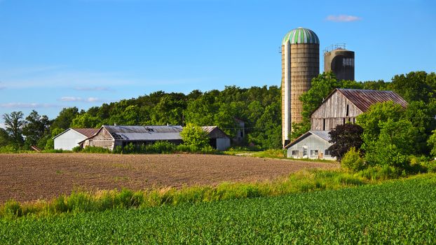 Older farm and field in spring