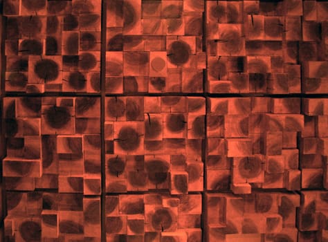 A wood textured ceiling with several layers of wooden squares