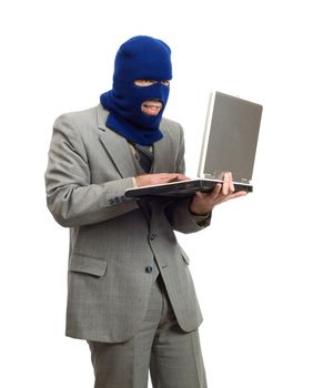 A hacker wearing a business suit is stealing company secrets