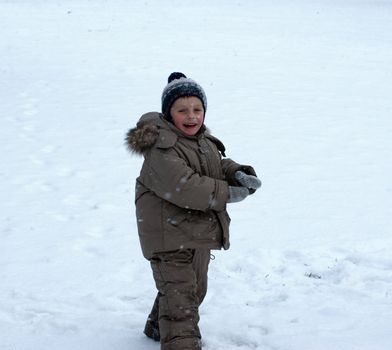boy play a snow field