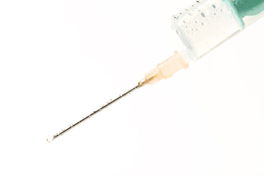 wet syringe with drop on white background