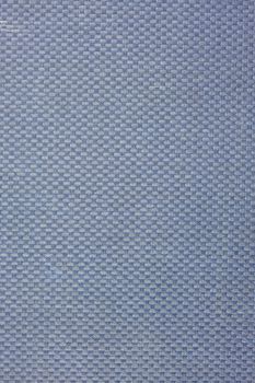 blue, coarse textile background from a vintage 1950s book cover