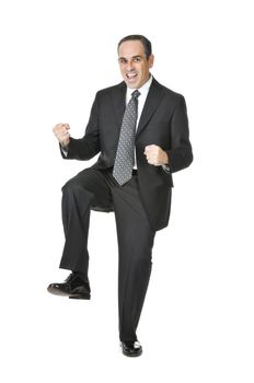 Triumphant businessman in a suit isolated on white background